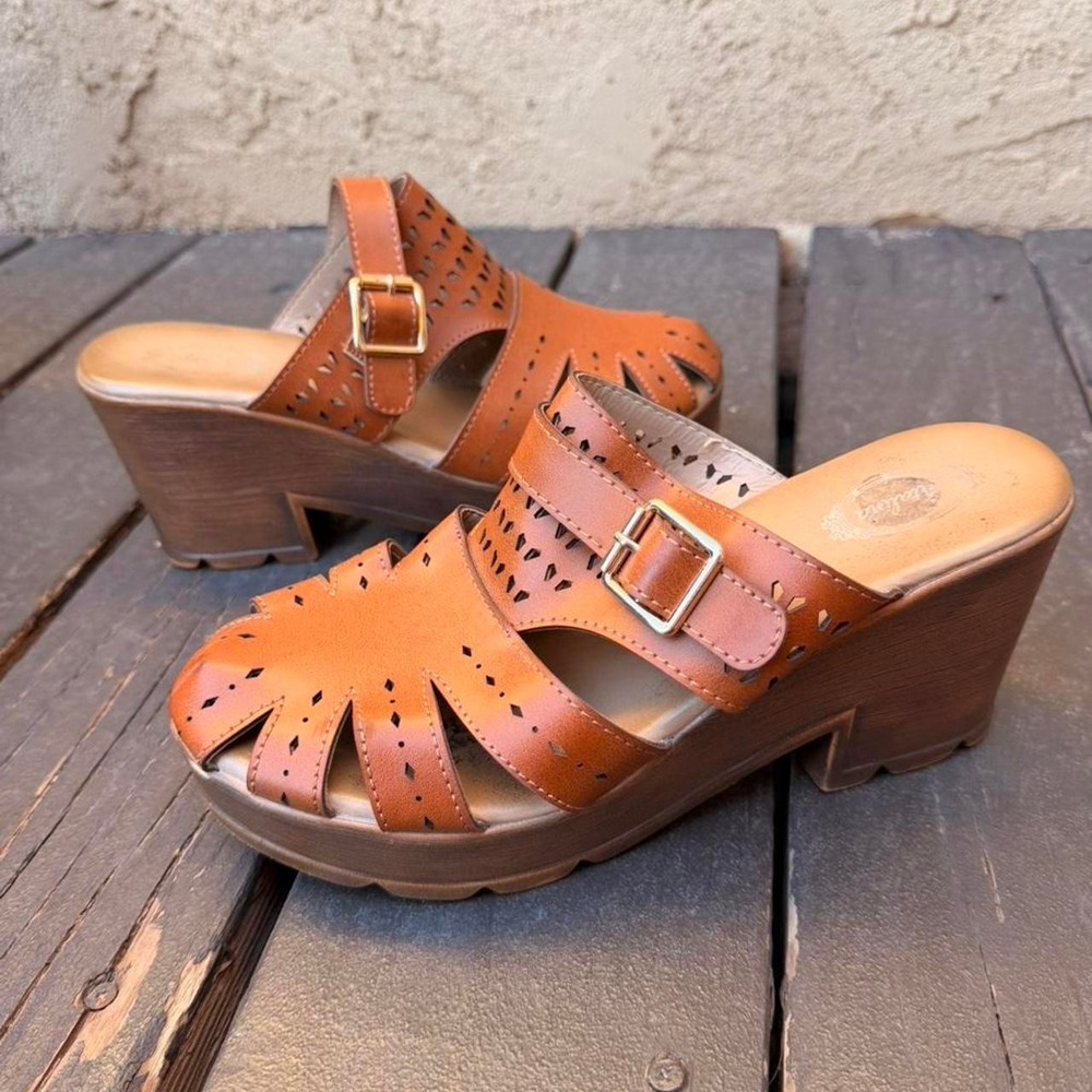 Brown leather clogs with buckle detail and cutouts